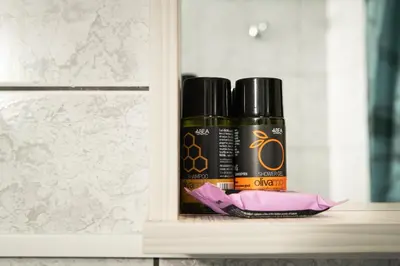 two bottles of essential oils sitting on a shelf at ''Meraviglia casa'' Ariadne in Kato Daratso