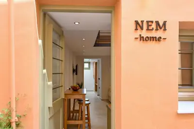 a hallway with a new home sign on a wall at Nem Home, amazing 1 bedroom house in Chania Town