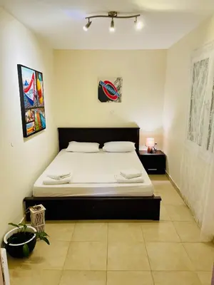 a bedroom with a large bed in a room at Mersini Apartment in Chania Town