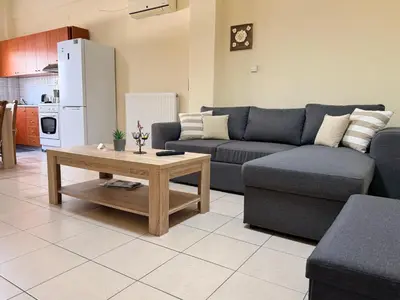 a living room with a couch and a coffee table at Neva's House in Chania in Chania Town