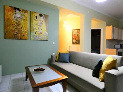 a living room with a couch and a coffee table at Mel Studio 2 (kalamaki) in Kalamaki Chanion