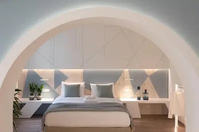 a bedroom with a bed with a large window at Casa Blue Dove in Chania Town