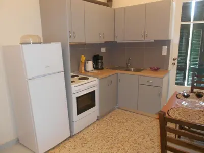 a kitchen with white appliances and a white refrigerator at Domus Nicola in Chania Town