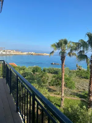 a view of the ocean from a balcony at At the Beach! +10min= port&center. in Chania Town