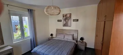 a bedroom with a bed and a window at Fifi's luxury apartment in Plataniás