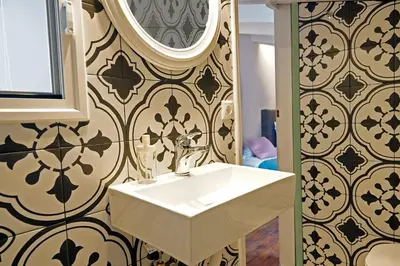 a bathroom with a sink and a mirror at Ariadne Luxury Home in Chania Town