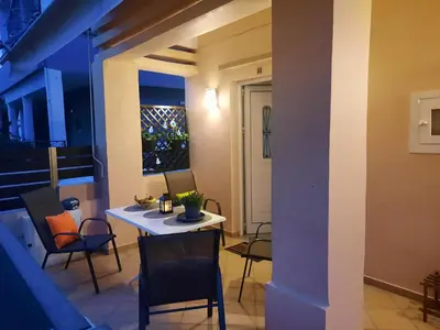a dining room with a table and chairs in a room at Pavlos Apartment in Chania Town