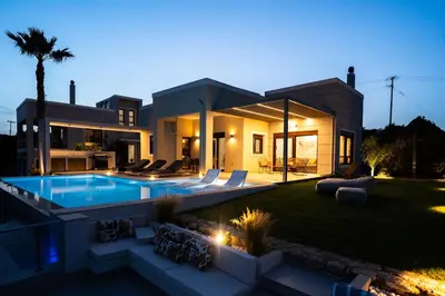 a house with a swimming pool in the backyard at Bay Overlook Villa in Korakiaí