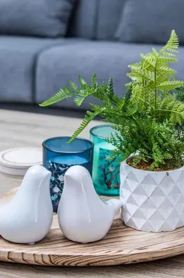 a table with two white vases and a potted plant at Luxury Katsoulakis Apartments in countryside in Alikianós