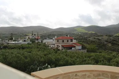 a view of a village with mountains in the background at Aloni Studio in Azoyirás