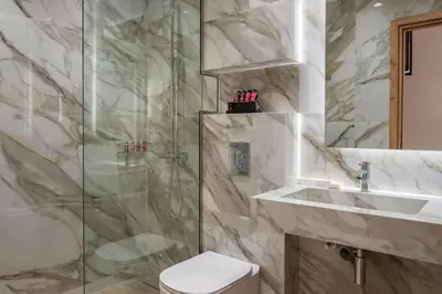 a bathroom with a shower and a toilet and a sink at La vista de Pablo in Chania Town