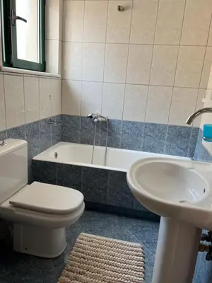 a bathroom with a toilet and a tub and a sink at Antonis Kavros appartment in the center of chania in Chania Town
