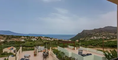 a house with a view of the ocean at Villa Seashell, Private Pool and Magnficent View in Ravdhoúkha