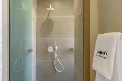 a shower with a glass door in a bathroom at Casbah Boutique Hotel in Palaiochóra