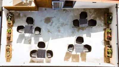 an overhead view of a group of chairs and tables at Emeli Suites in Chania Town