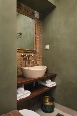 a bathroom with a sink and a mirror at Nobili Boutique Hotel in Chania Town