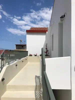 a stairway to the roof of a house at Lithos Retreat (ΛΙTHOS Retreat) in Kolymvari