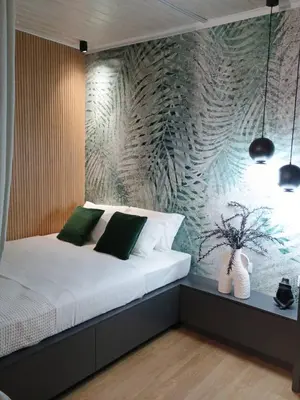 a bedroom with a white bed with a wall at Casa Del Miele, private pool, BBQ, mountain view. in Alikianós