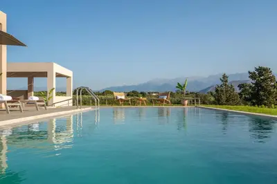 a swimming pool with blue water in a house at Villa Anastasia with private heated pool and privacy in Chania Town