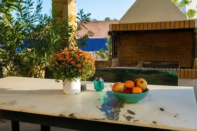 a table with a bowl of fruit on it at Villa Jokasta & Erato in Chania Town