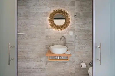 a bathroom with a sink and a mirror at Belle Epoque Halepa's House in Chania Town