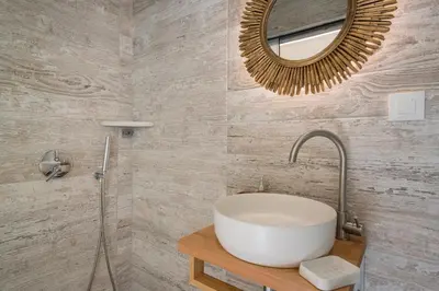 a bathroom with a sink and a mirror at Belle Epoque Halepa's House in Chania Town