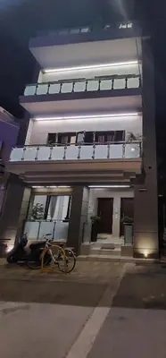 a building with a bike parked in front of it at Rika’s seaside apartments in Chania Town