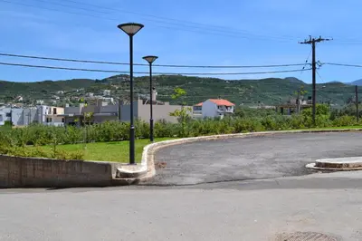 an empty street with two street lights on the side of a road at Kissamos Nice Apartment2 in Kissamos