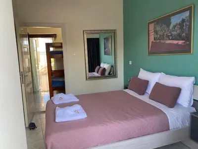 a bedroom with a large bed with two towels on it at Kissamos Nice Apartment2 in Kissamos