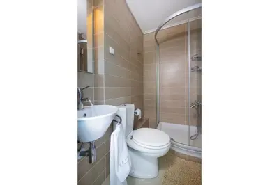a bathroom with a toilet and a sink at Epavlis Akrotiri in Chania Town