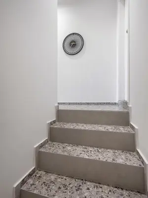 a set of stairs with a fan next to a door at Cretan Berry Kondylaki in Chania Town