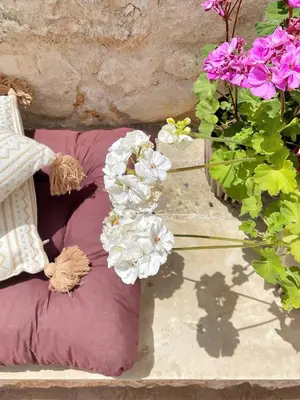 a group of pillows and flowers on a table at FLAT 45 in Kounoupidhianá