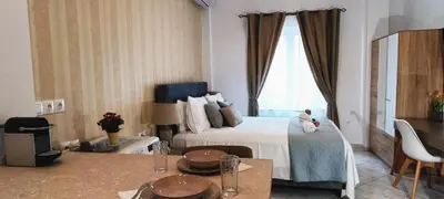 a hotel room with a bed and a window at Virma Studio in Chania Town