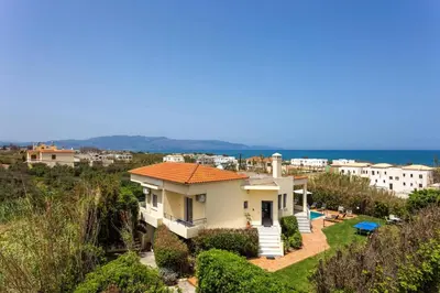 a villa with a view of the ocean at Villa Aggeliki by Villa Plus in Pírgos Psilonérou