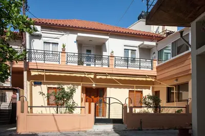 a large house with a balcony on top of it at Georgia's House Chania in Chania Town