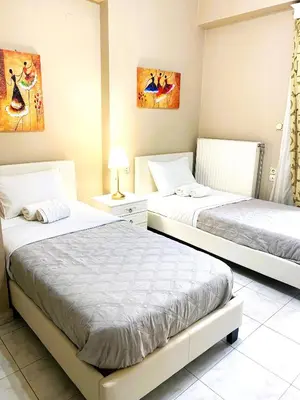 two beds in a hotel room with two beds at Christina_Apt in Chania Town