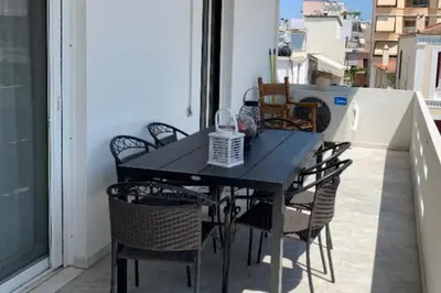 a black table and chairs on a balcony at Christina_Apt in Chania Town