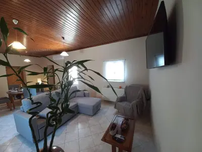 a living room with a couch and a table at Casa Constans in Maleme