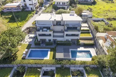 an aerial view of a house with two swimming pools at Luxury Villas near The Sea With Heated Pool in Kato Daratso