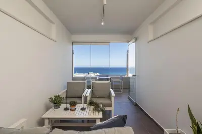 a living room with a view of the ocean at Luxury Villas near The Sea With Heated Pool in Kato Daratso