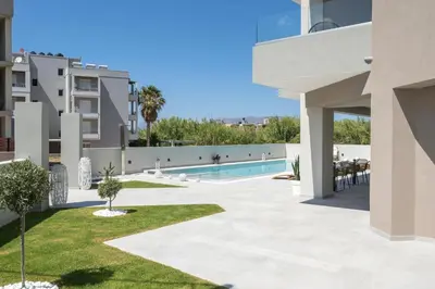 a view of the courtyard of a building with a swimming pool at Kallistefan in Kissamos