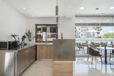 a kitchen and dining room with a table and chairs at Kallistefan in Kissamos