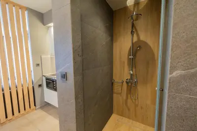 a shower with a glass door in a bathroom at Villy Luxury Home by the Sea 2 in Ayiá