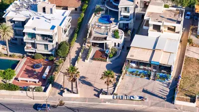 an overhead view of a street with houses and palm trees at Villy Luxury Home by the Sea 2 in Ayiá