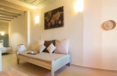 a living room with a couch with pillows on it at Auntie's home by Chania Old Harbor in Chania Town