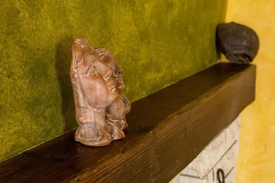 a statue of a horse on a green wall at Samonas - Green villa Faskomilia in Chania Town
