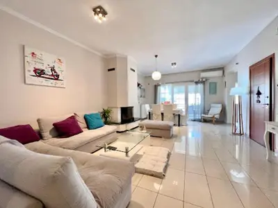 a large living room with a couch and a table at Central apartment in quiet neighborhood near sandy beach in Chania Town