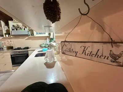 a kitchen with a white counter with a sign on it at Eco Friendly Country Home in Kókkinos Pírgos