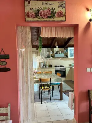 a kitchen and dining room with a table and chairs at Eco Friendly Country Home in Kókkinos Pírgos