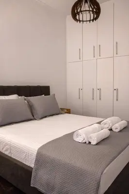 a bedroom with a bed with towels on it at Sfakion 6 apartment in Chania Town